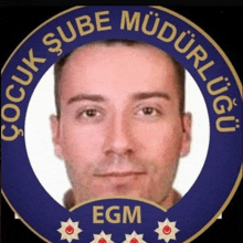 a man 's face is in the center of a badge that says egm