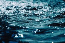 a close up of a body of water with bubbles in it