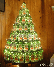 a christmas tree made out of jagermeister bottles and lights