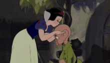 a cartoon of snow white kissing a dwarf 's head