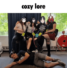 a group of people are posing for a photo and the caption says cozy lore