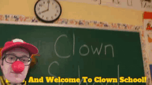 a man with a red nose is standing in front of a blackboard that says clown on it