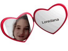 a heart shaped mirror with the name loredana on the front