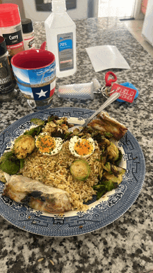 a plate of food on a counter with a bottle of 70 % alcohol next to it