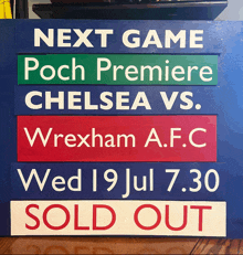 a sign that says next game poch premiere chelsea vs wrexham a.f.c on it