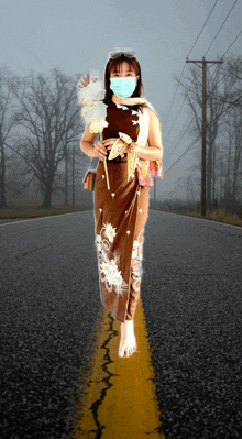 a woman wearing a mask is walking barefoot down the road