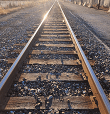 a train track with a lot of rocks on the ground