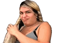 a woman in a gray tank top is holding her hair and making a funny face