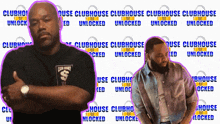 two men stand in front of a wall that says clubhouse unlocked