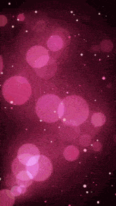 a purple background with pink circles and white dots on it