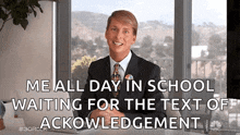 a man in a suit and tie is sitting at a desk and waiting for the text of an acknowledgement