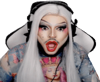 a drag queen with white hair and red lips