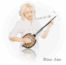 a woman playing a musical instrument with the name rino aise below her