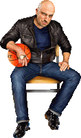 a man in a leather jacket is sitting on a chair holding a basketball that says lht