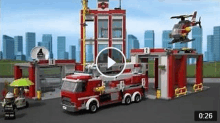 a lego fire station with a fire truck , helicopter , and fireman .