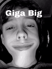 a black and white photo of a young boy with the words giga big written above his head