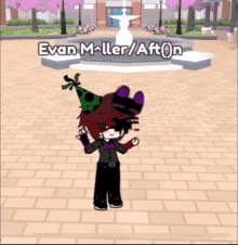 evan miller / afton is standing in front of a fountain wearing a party hat