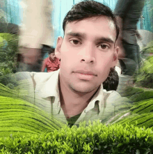 a man takes a selfie with a green background