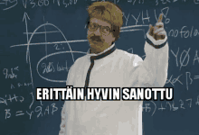 a man in front of a blackboard with the words " erittain hyvin sanottu "