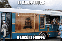 a blue and white food truck says le kamel truck a encore frappe