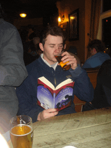 a man drinking a beer and reading a book called romeo and juliet