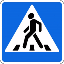 a blue and white crosswalk sign with a black silhouette of a person walking