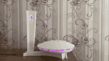 a white item with a purple star on it is sitting on a table in front of a floral wallpaper