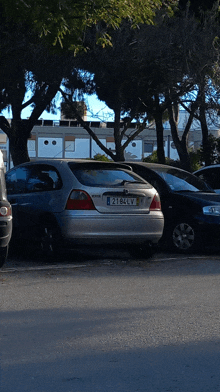 a silver honda car with a license plate that says 218clv