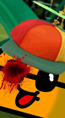 a colorful hat with a green star on it is on a yellow background