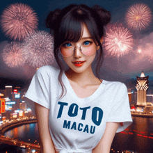 a girl wearing a toto macau t-shirt stands in front of fireworks