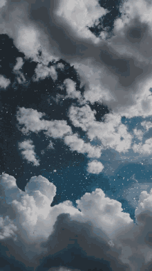 a night sky with clouds and stars in the background