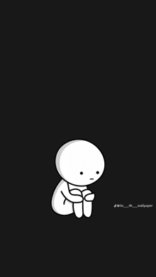 a white cartoon character is sitting on a black background with his arms around his knees .