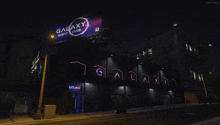 galaxy night club is advertised on the side of a building