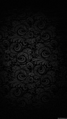 a black background with a pattern of swirls