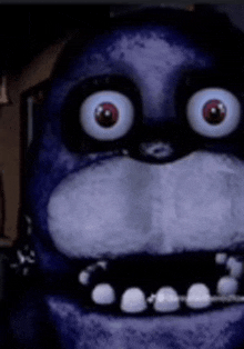 a close up of bonnie from five nights at freddy 's with big eyes .