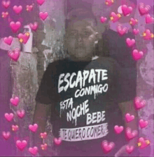 a man is wearing a black shirt that says escapate conmigo .