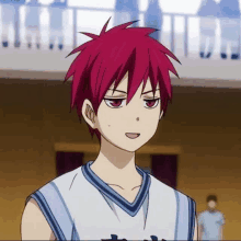 a boy with red hair is wearing a basketball jersey .