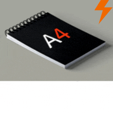 a spiral notebook with the letter a4 on the cover