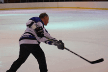 a hockey player wears a jersey that says tribute on the back