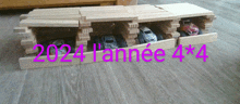 a row of toy cars are stacked on top of each other with 2024 l' année 4x4 written in pink