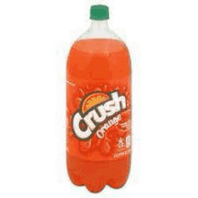 a bottle of crush orange soda is sitting on a white surface .