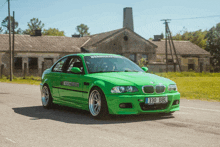 a green bmw with license plate 330 bbl