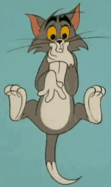 tom from tom and jerry is sitting on his hind legs holding a piece of cheese in his mouth .