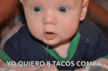 a baby is laying on a bed with the words yo quiero 8 tacos compa on the bottom