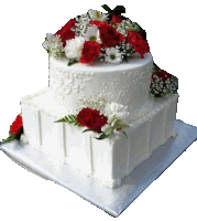 a white cake with red and white flowers on top of it