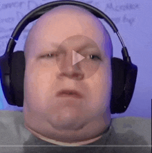 a man wearing headphones looks at the camera with a play button on his face