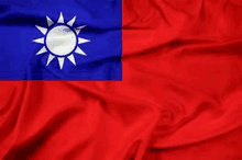 a close up of a waving flag of taiwan .