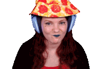 a woman wearing headphones and a pizza hat