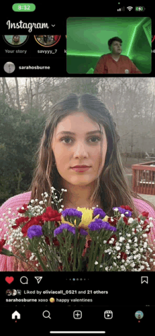 a woman is holding a bouquet of flowers on a phone screen