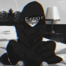 a person wearing a black hoodie with the word error written on it